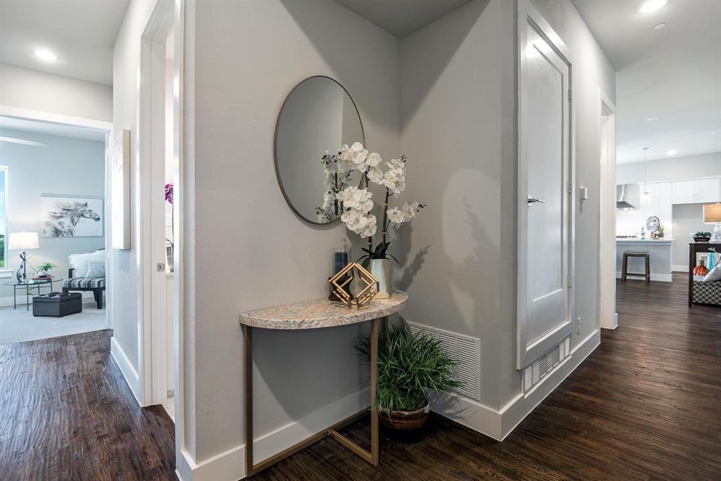 770 North Plano Road, Unit 303 Richardson, TX 75081 - Photo 4 of 26 Hallway featuring dark wood flooring, light grey walls, and white baseboards