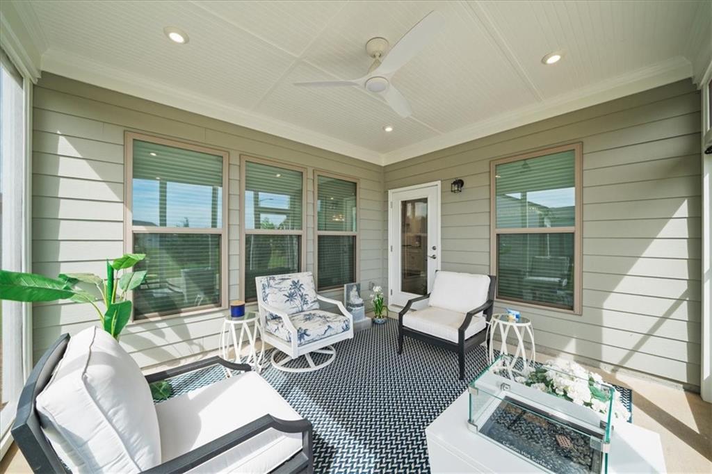 2457 Naples Street Hoschton, GA 30548 - Photo 27 of 41 a living room with furniture and a large window