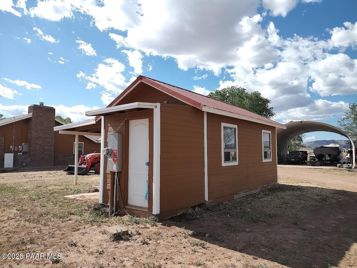 3980 West Rocky Road Paulden, AZ 86334 - Photo 21 of 32 a front view of a house with a yard