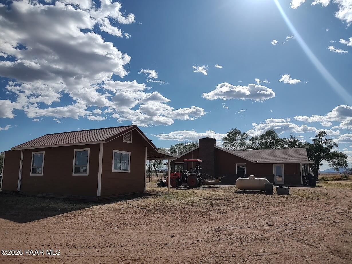 3980 West Rocky Road Paulden, AZ 86334 - Photo 22 of 32 a front view of a house with a yard and garage