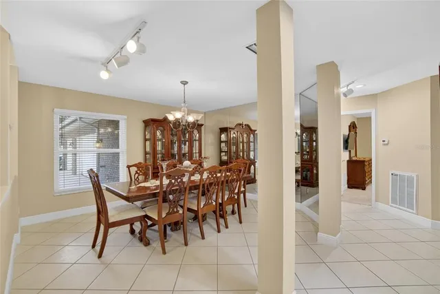 a kitchen with stainless steel appliances kitchen island granite countertop a stove and cabinets