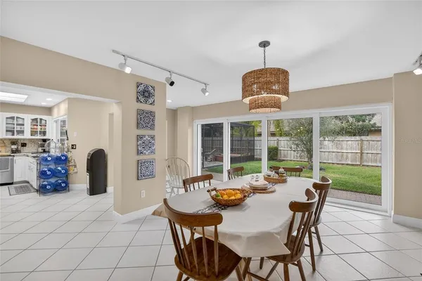 a bathroom with a sink a mirror and potted plant