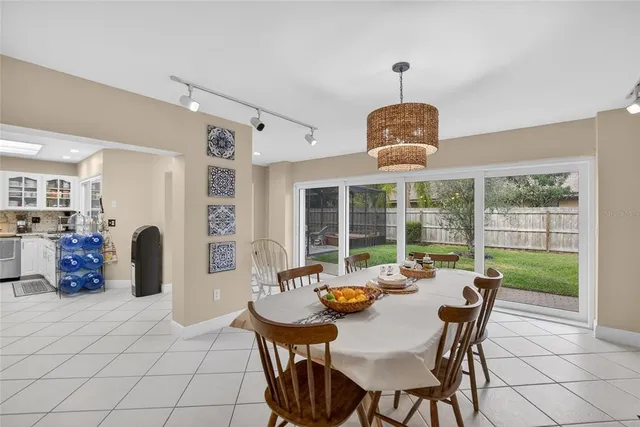 a bathroom with a sink a mirror and potted plant