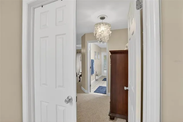 a bedroom with a bed window and a flat screen television