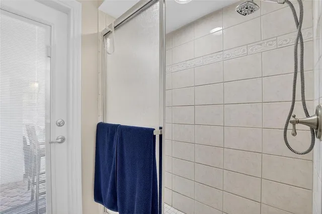 a view of walk in closet with clothes