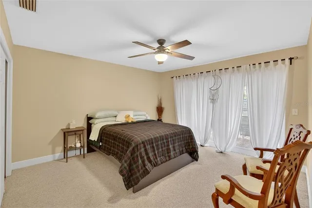 a spacious bathroom with a tub sink and mirror