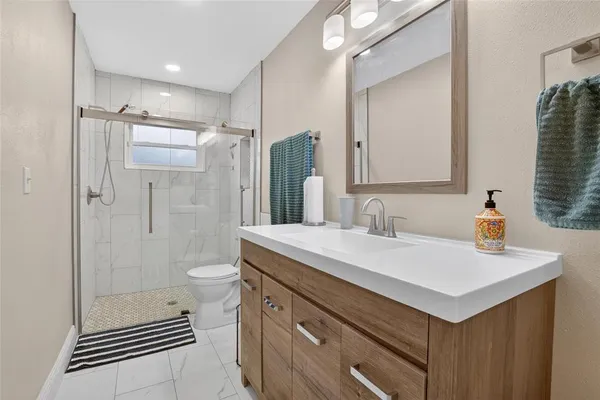 a view of a patio with table and chairs potted plants with wooden floor