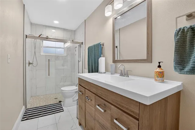 a view of a patio with table and chairs potted plants with wooden floor