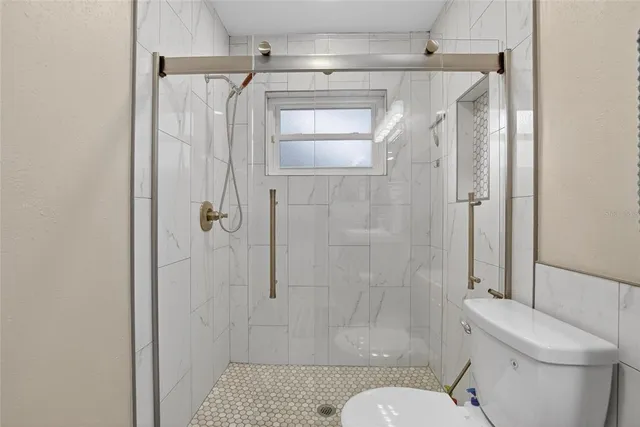 a view of a house with a garden and porch