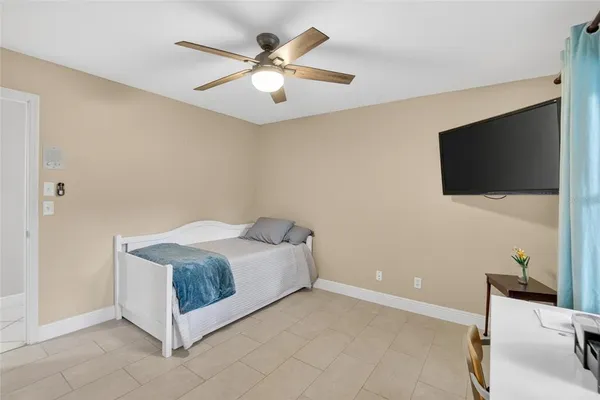 a front view of a house with a garden and yard