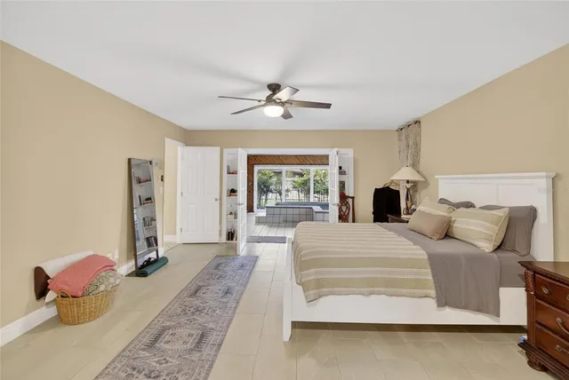 a view of a house with a yard and large tree