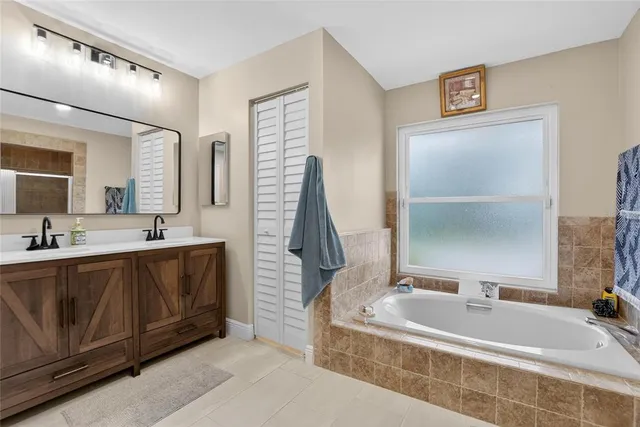 an aerial view of a house with a yard and trees