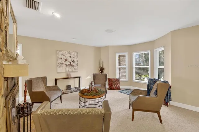 a view of a dining room with furniture and chandelier