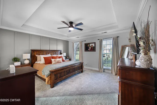 a bedroom with bed and window