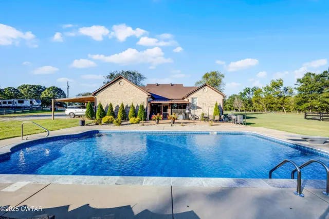 a view of swimming pool with lounge chair