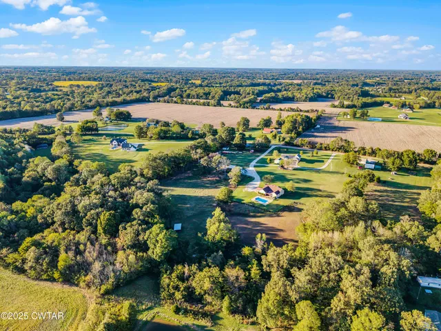 a view of swimming pool with a yard