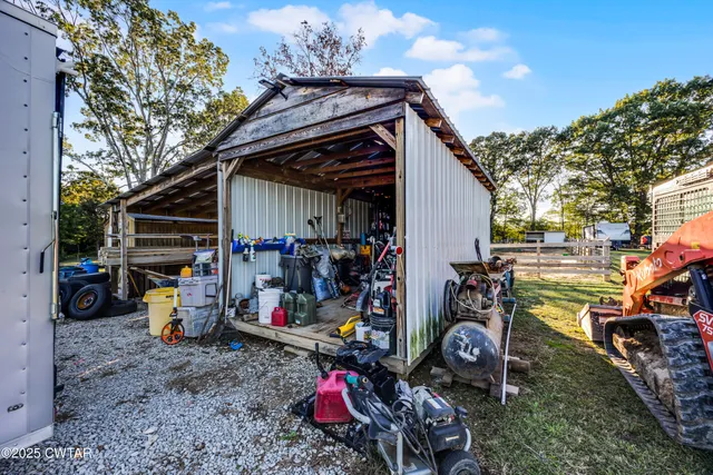 a view of a park with large trees