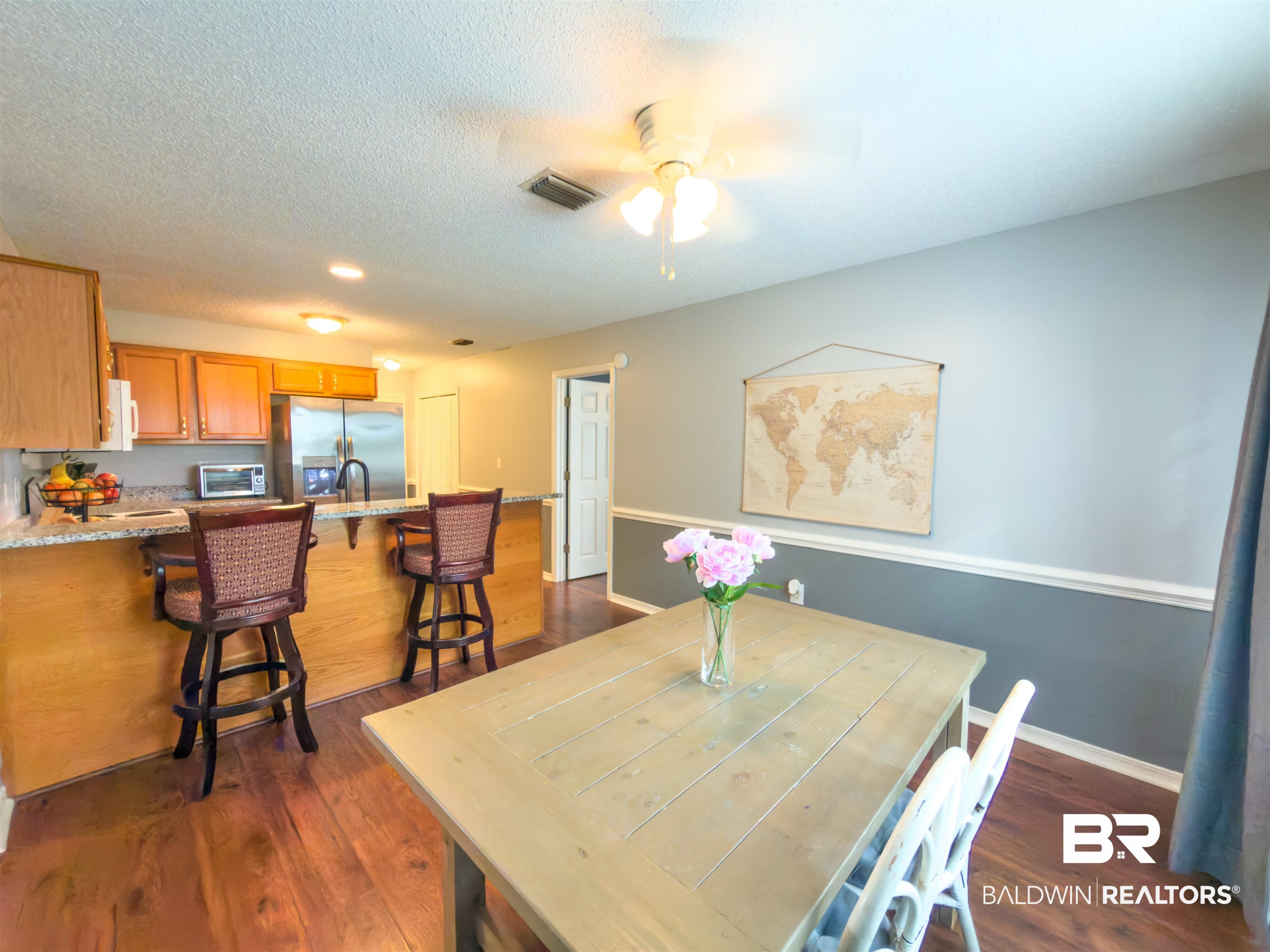 129 Pennbrooke Loop Foley, AL 36535 - Photo 20 of 44 Dining room featuring dark wood-type flooring, a ceiling fan, and a textured ceiling