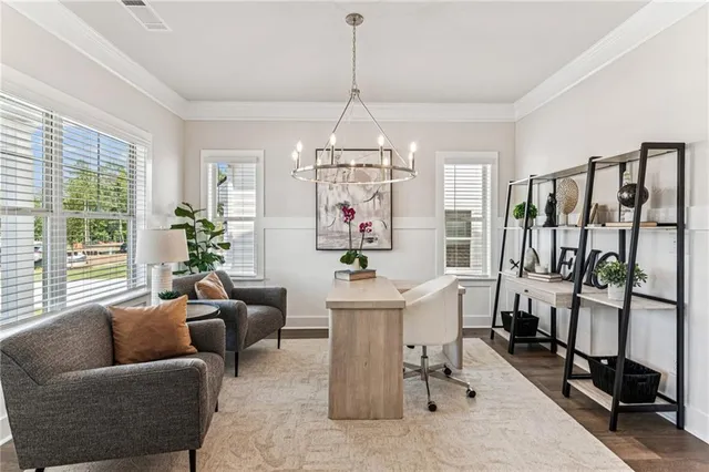 a living room with furniture a chandelier and a chandelier
