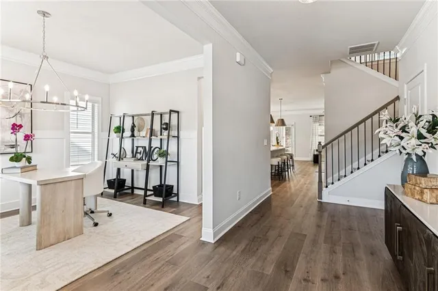 a view of a kitchen with furniture and staircase