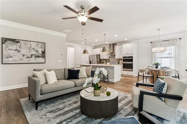 a living room with furniture kitchen and a kitchen view