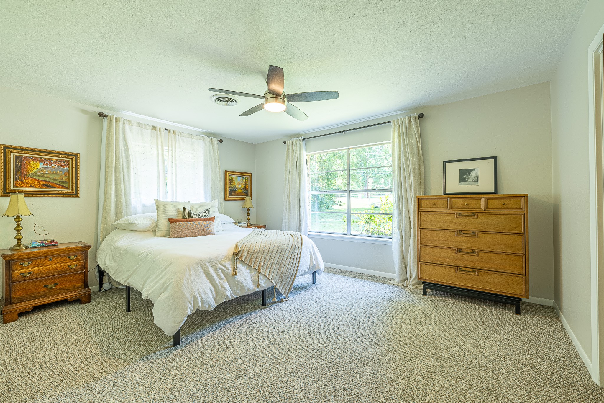 1009 Fish Hatchery Road Huntsville, TX 77320 - Photo 11 of 16 a spacious bedroom with a bed and a dresser