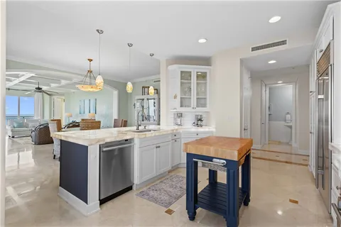 a kitchen with a stove a refrigerator and a dining table