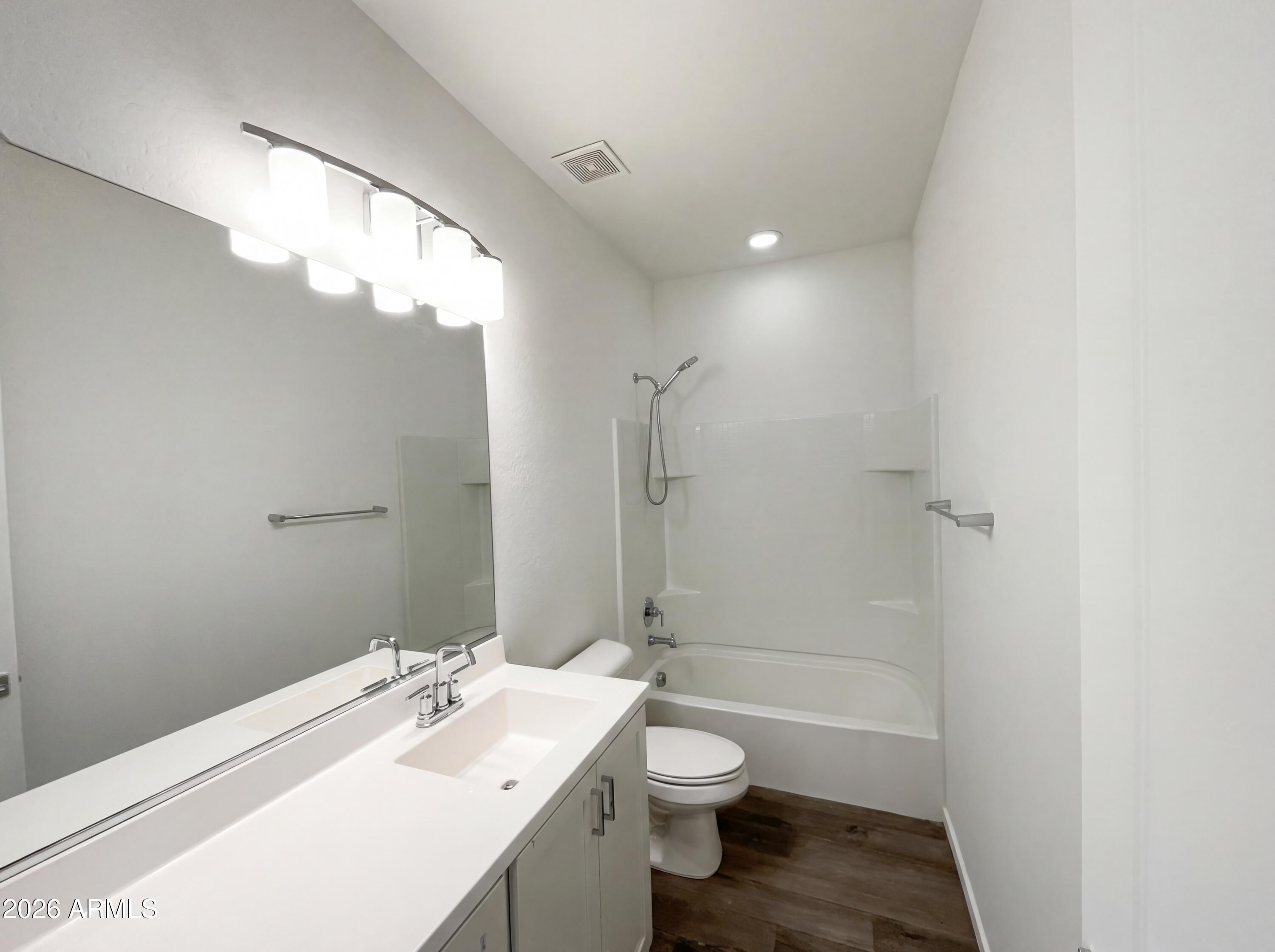 901 South Smith Road, Unit 1074 Tempe, AZ 85281 - Photo 15 of 23 a bathroom with a sink a toilet and shower