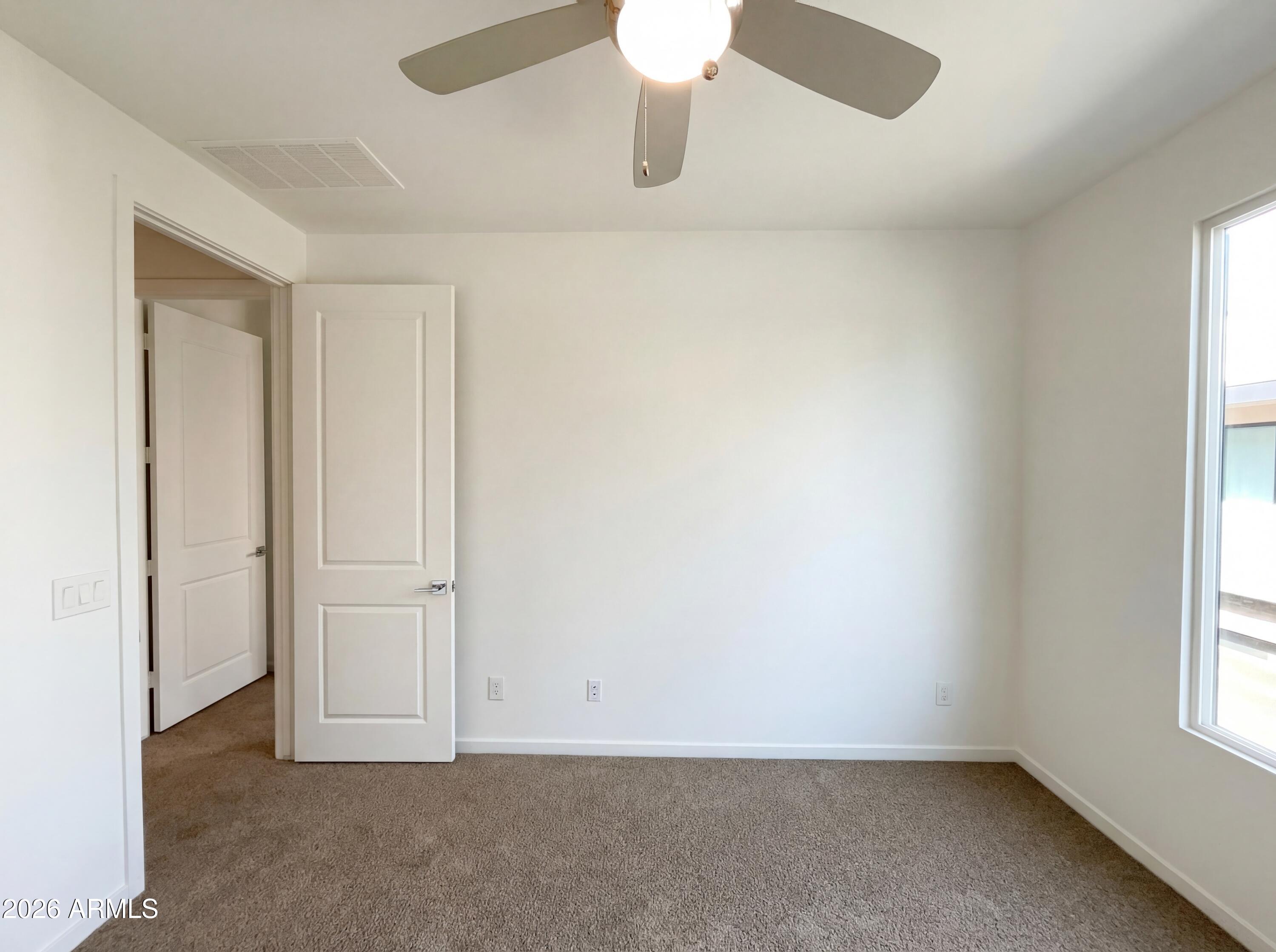 901 South Smith Road, Unit 1074 Tempe, AZ 85281 - Photo 17 of 23 an empty room with windows