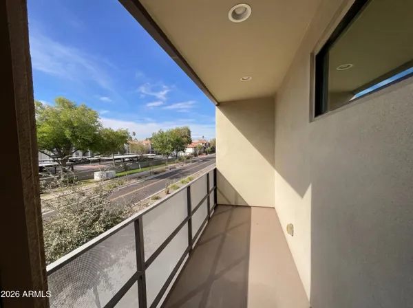a view of balcony with two chairs