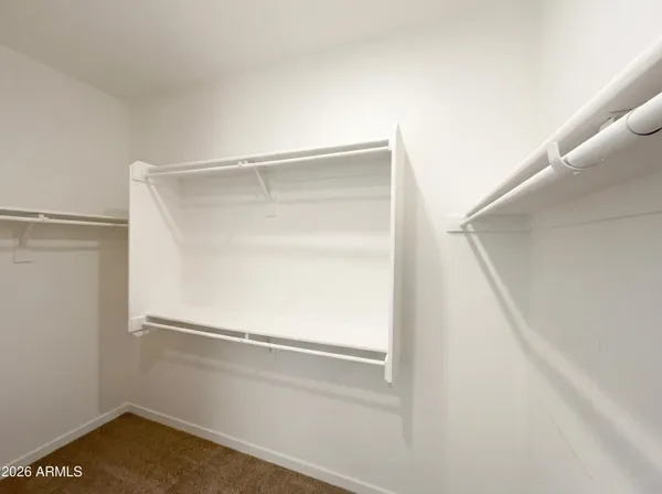a view of an empty walk in closet