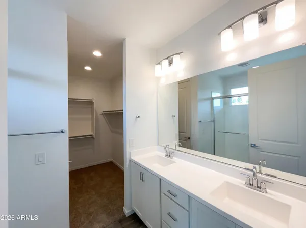 a bathroom with a double vanity sink mirror and double