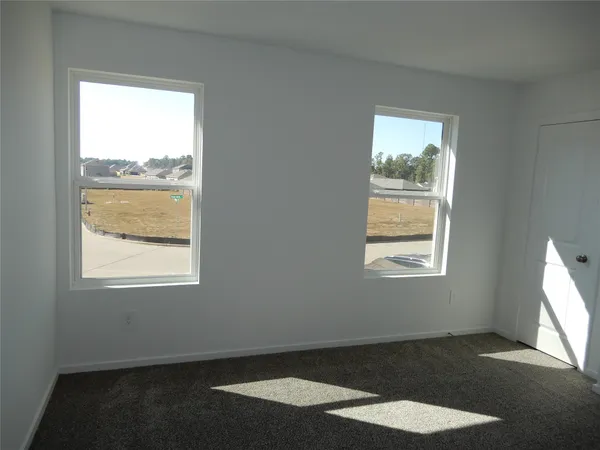 a bathroom with a toilet and a bath tub