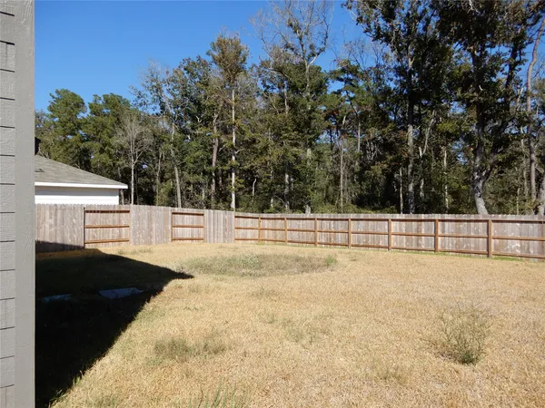 a white house with trees in front of it