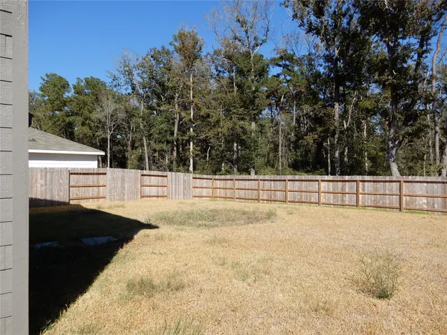a house with trees in the background