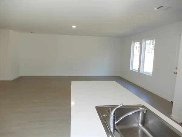 a kitchen with a refrigerator sink and microwave