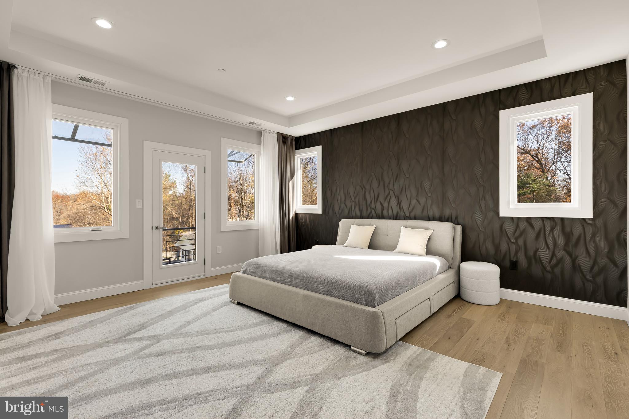 14051 Esworthy Road Darnestown, MD 20874 - Photo 17 of 50 a spacious bedroom with a large bed and a window