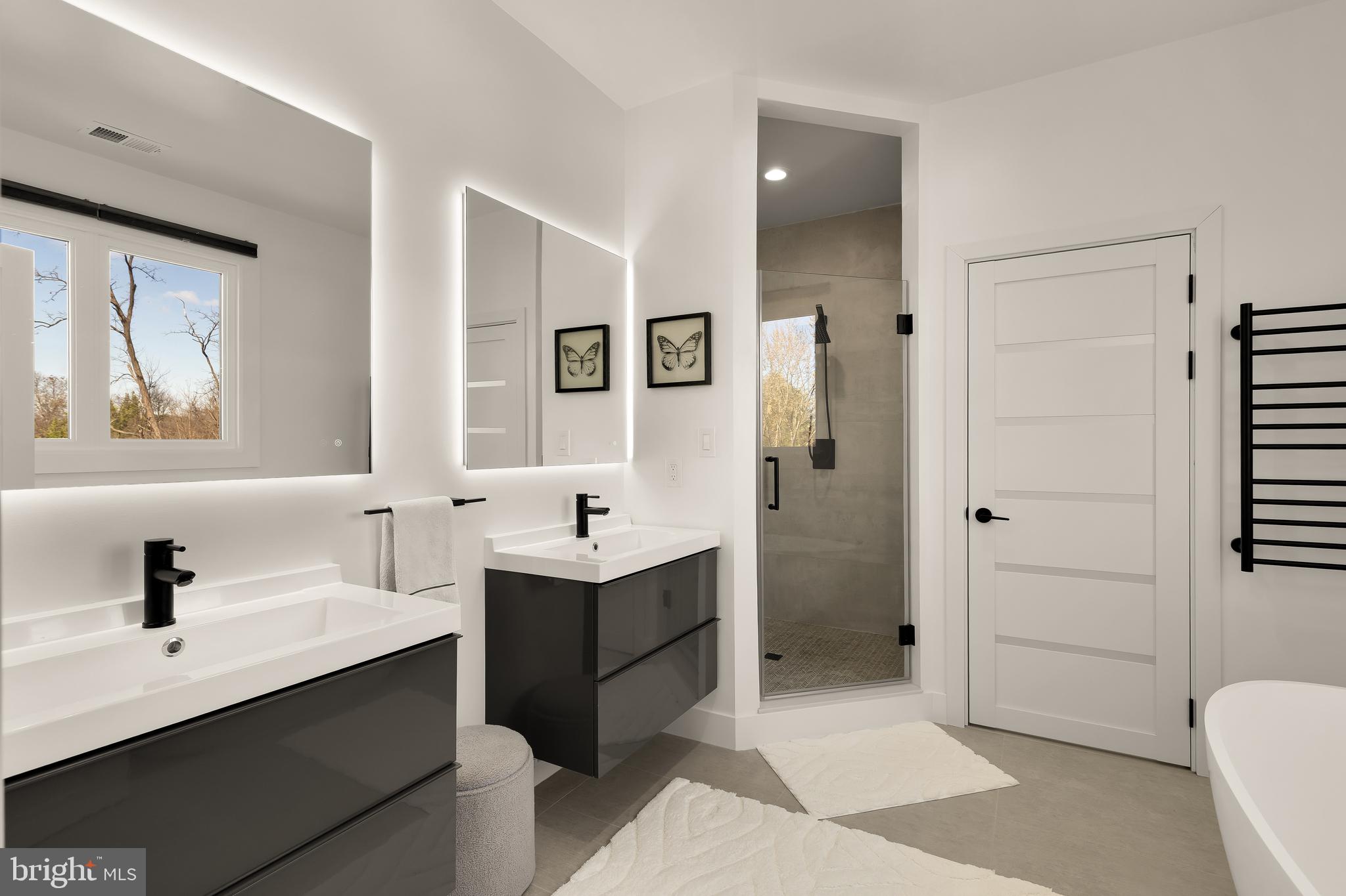 14051 Esworthy Road Darnestown, MD 20874 - Photo 21 of 50 a bathroom with a double vanity sink a toilet and shower