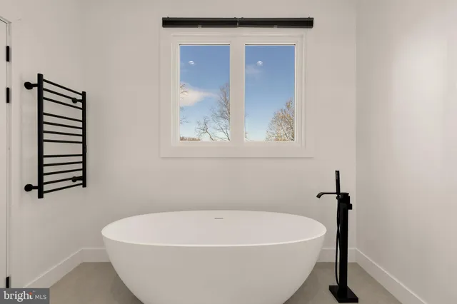 a bathroom with a double vanity sink and mirror
