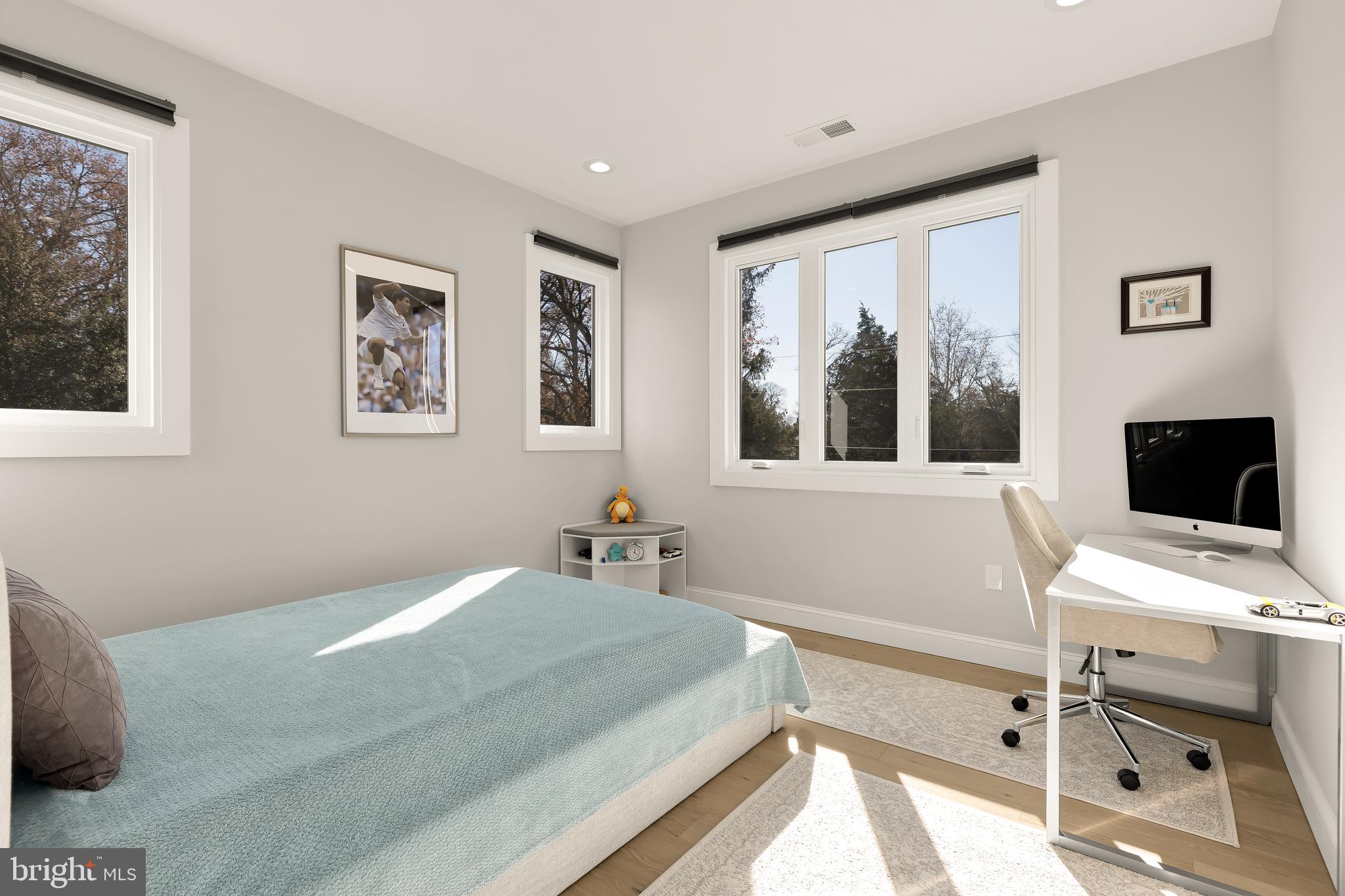 14051 Esworthy Road Darnestown, MD 20874 - Photo 26 of 50 a bedroom with a bed and a flat screen tv