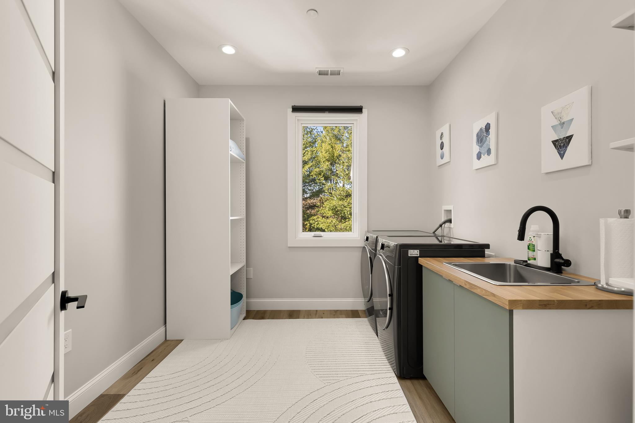 14051 Esworthy Road Darnestown, MD 20874 - Photo 28 of 50 a kitchen with stainless steel appliances granite countertop a sink and a refrigerator