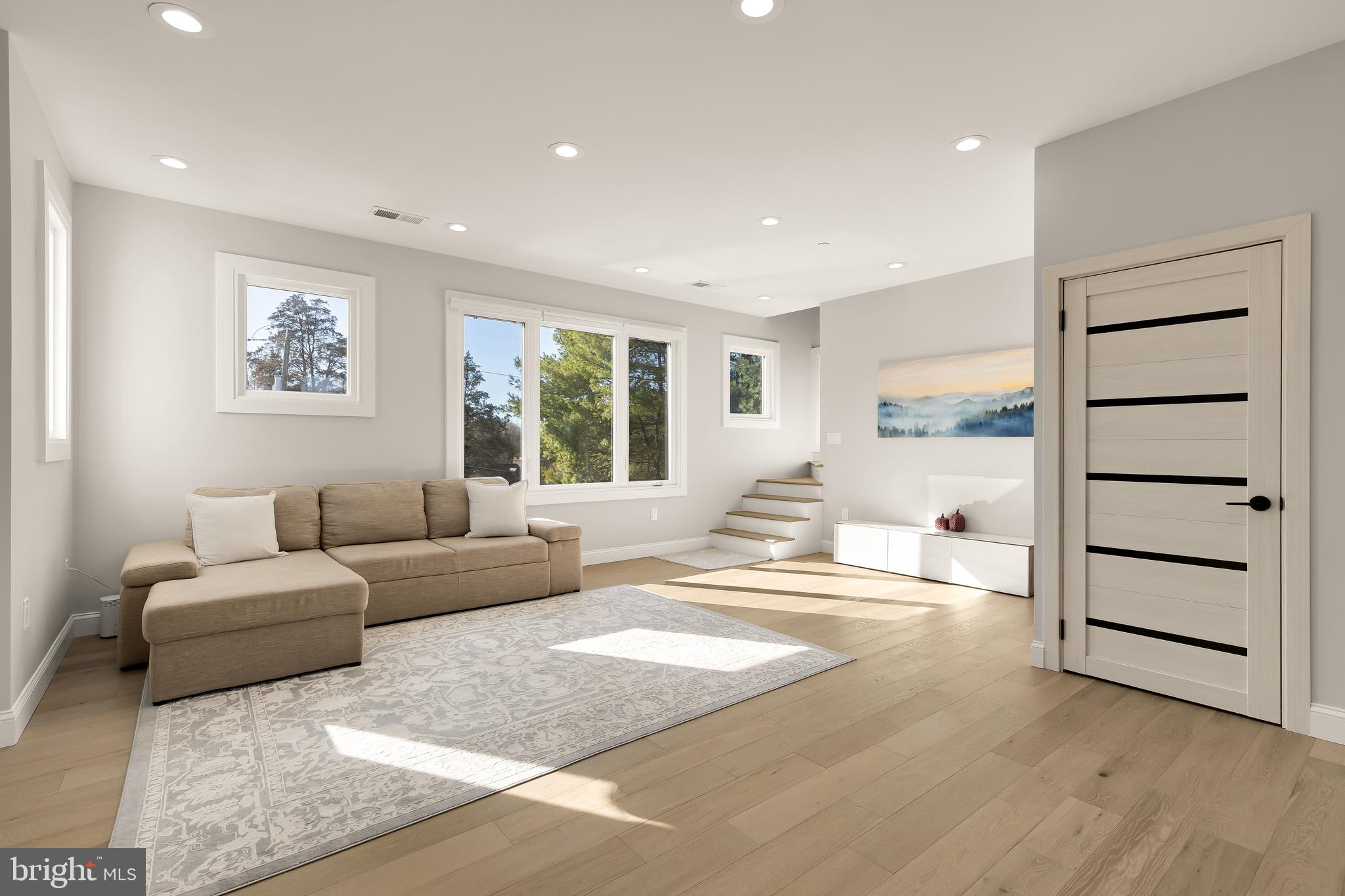 14051 Esworthy Road Darnestown, MD 20874 - Photo 38 of 50 a living room with furniture and a large window