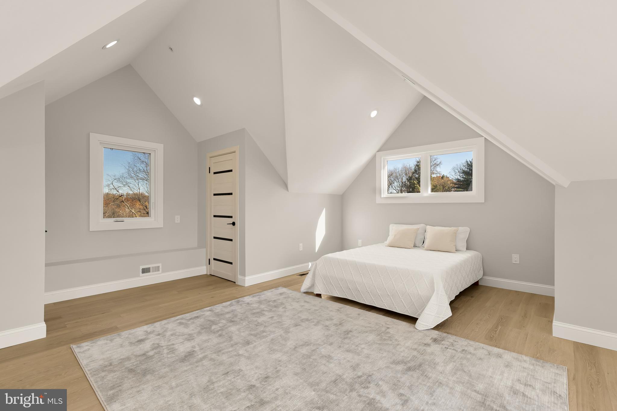 14051 Esworthy Road Darnestown, MD 20874 - Photo 41 of 50 a spacious bedroom with a bed and a painting on the wall