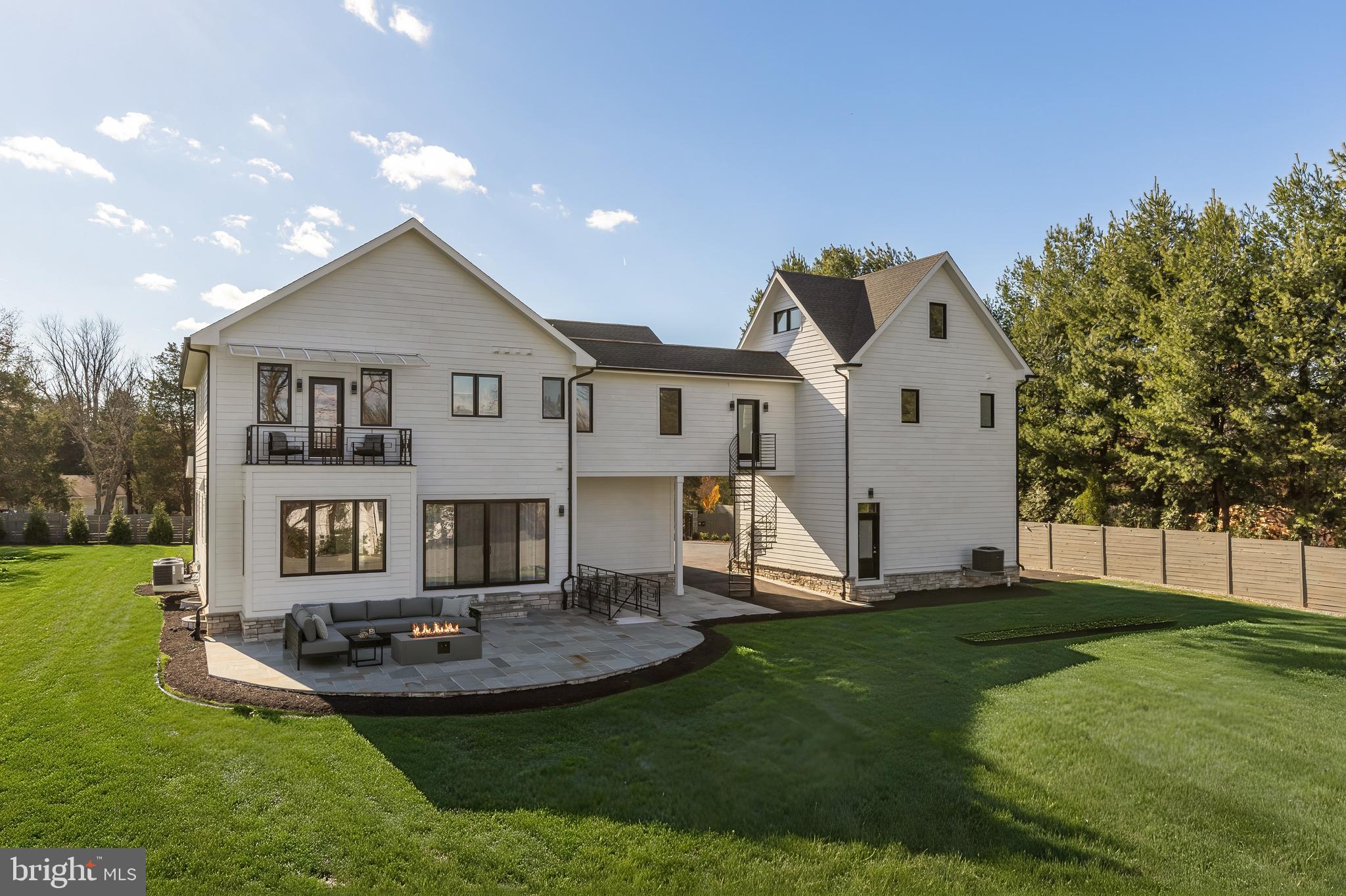 14051 Esworthy Road Darnestown, MD 20874 - Photo 48 of 50 a front view of a house with a yard and entertaining space