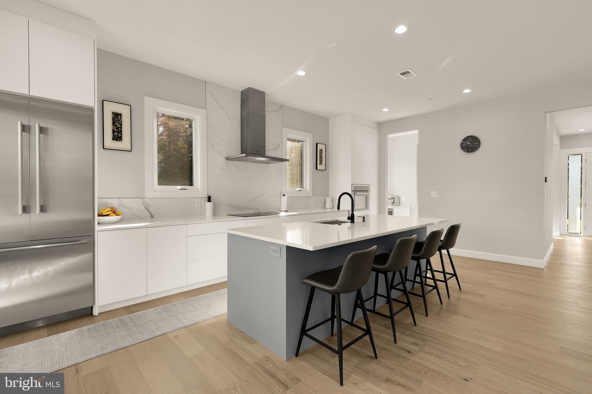 14051 Esworthy Road Darnestown, MD 20874 - Photo 8 of 50 a kitchen with a sink cabinets and wooden floor