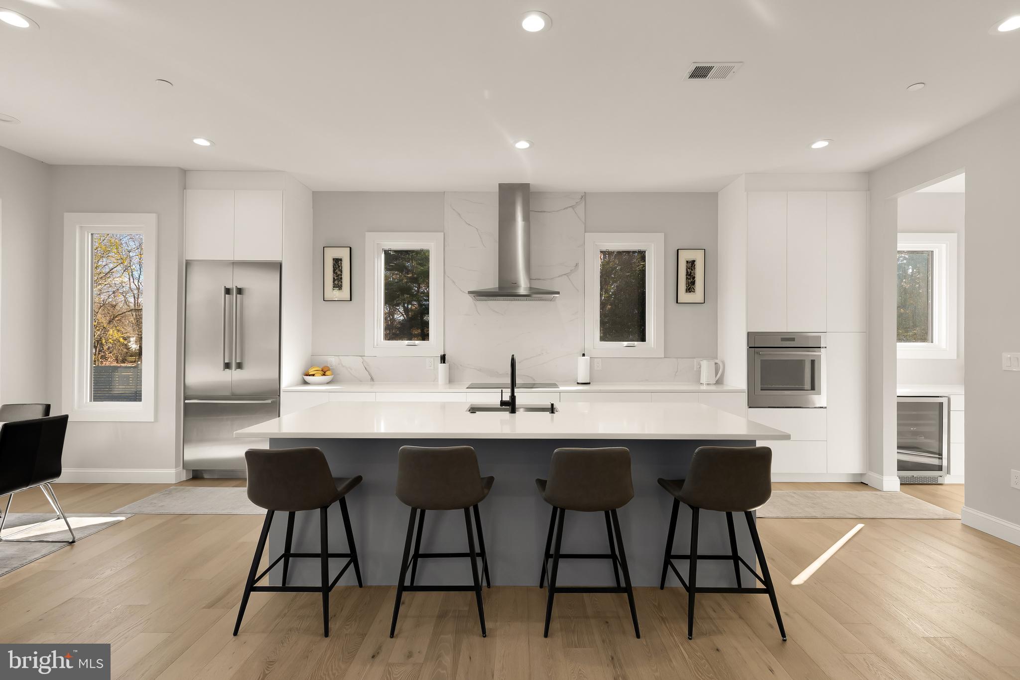 14051 Esworthy Road Darnestown, MD 20874 - Photo 9 of 50 a kitchen with a table and chairs in it