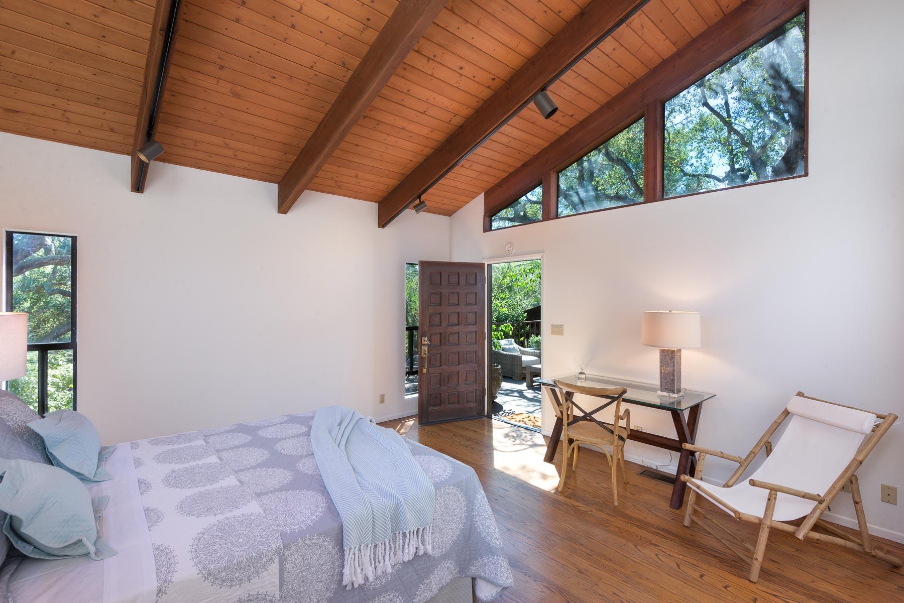 1530 Hillcrest Road Santa Barbara, CA 93103 - Photo 7 of 15 a bedroom with a bed a chair and a large window