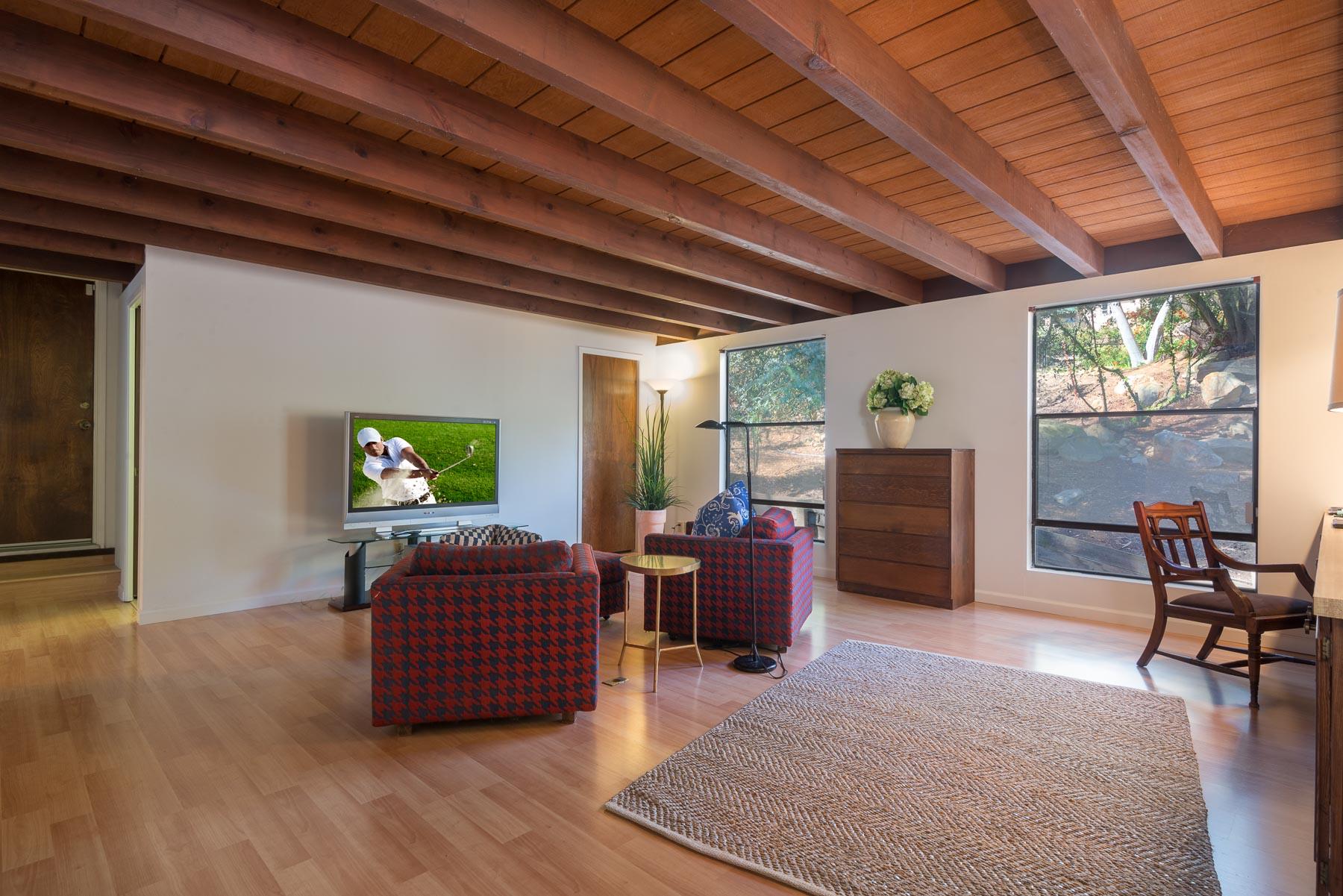 1530 Hillcrest Road Santa Barbara, CA 93103 - Photo 8 of 15 a living room with furniture a fireplace and a flat screen tv