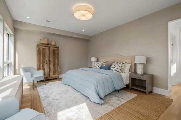 a bedroom with a large bed and a couch