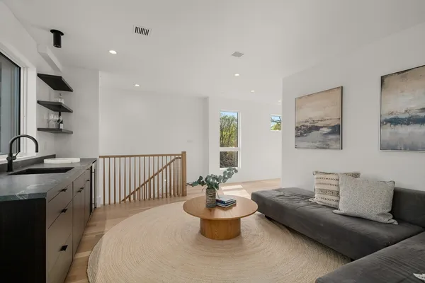 a living room with furniture and a potted plant